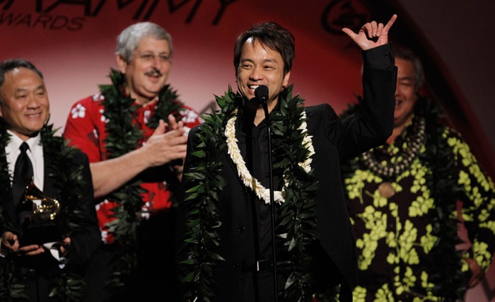 Producers Daniel Ho, center, accepts best Hawaiian music album at the Grammy Awards on Sunday, Jan. 31, 2010, in Los Angeles. In background looking on are, Wayne Wong, Paul Konwiser and George Kahumoku.(Photo: AP)