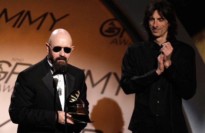 Rob Halford, of Judas Priest, accepts the award for best metal performance for "Dissident Aggressor" at the Grammy Awards on Sunday, Jan. 31, 2010, in Los Angeles. Looking on at right is Scott Travis.(Photo: AP)