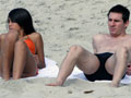 Messi spotted sunbathing with girlfriend