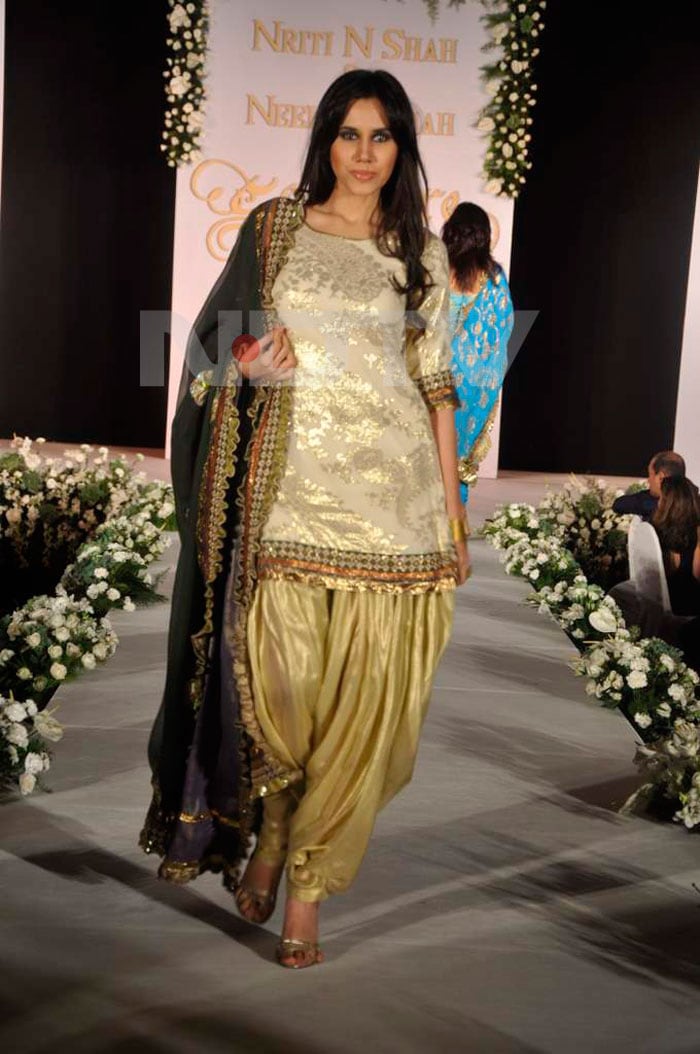 A model walking the ramp for Neelam and Nriti Shah.