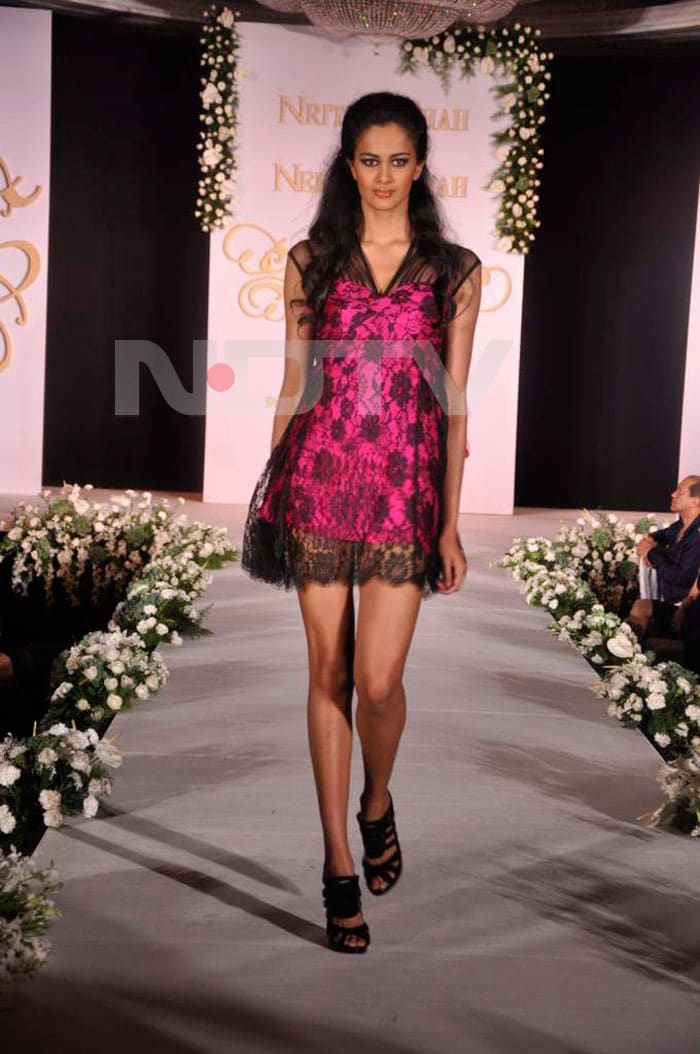 A model walking the ramp for Neelam and Nriti Shah.