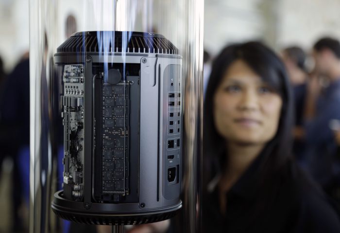 Apple showed off a new line of Mac computers, including a sleek, cylindrical-shaped Mac Pro due later this year.