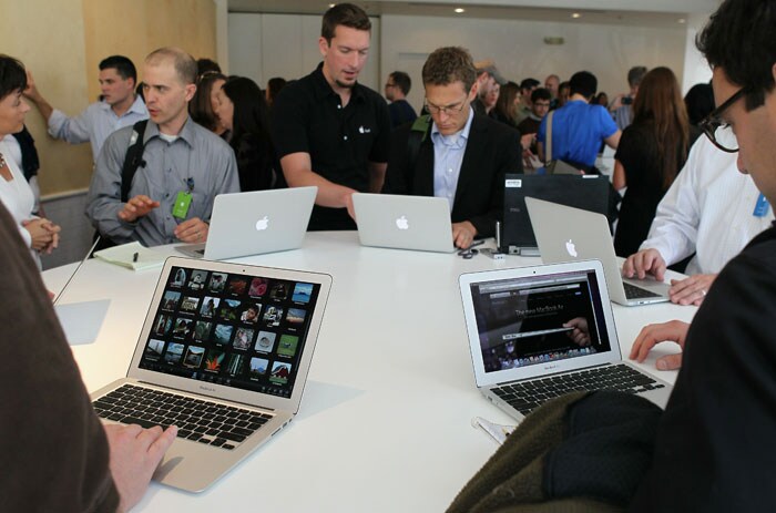 Members of the media look at a display of the new Mac Book Air during an Apple special event at the company's headquarters in Cupertino, California. Apple CEO Steve Jobs announced the new MacBook Air in eleven and thirteen inch models starting at $999. He also announced the OSX Lion operating system for Mac computers.(Photo AFP)
