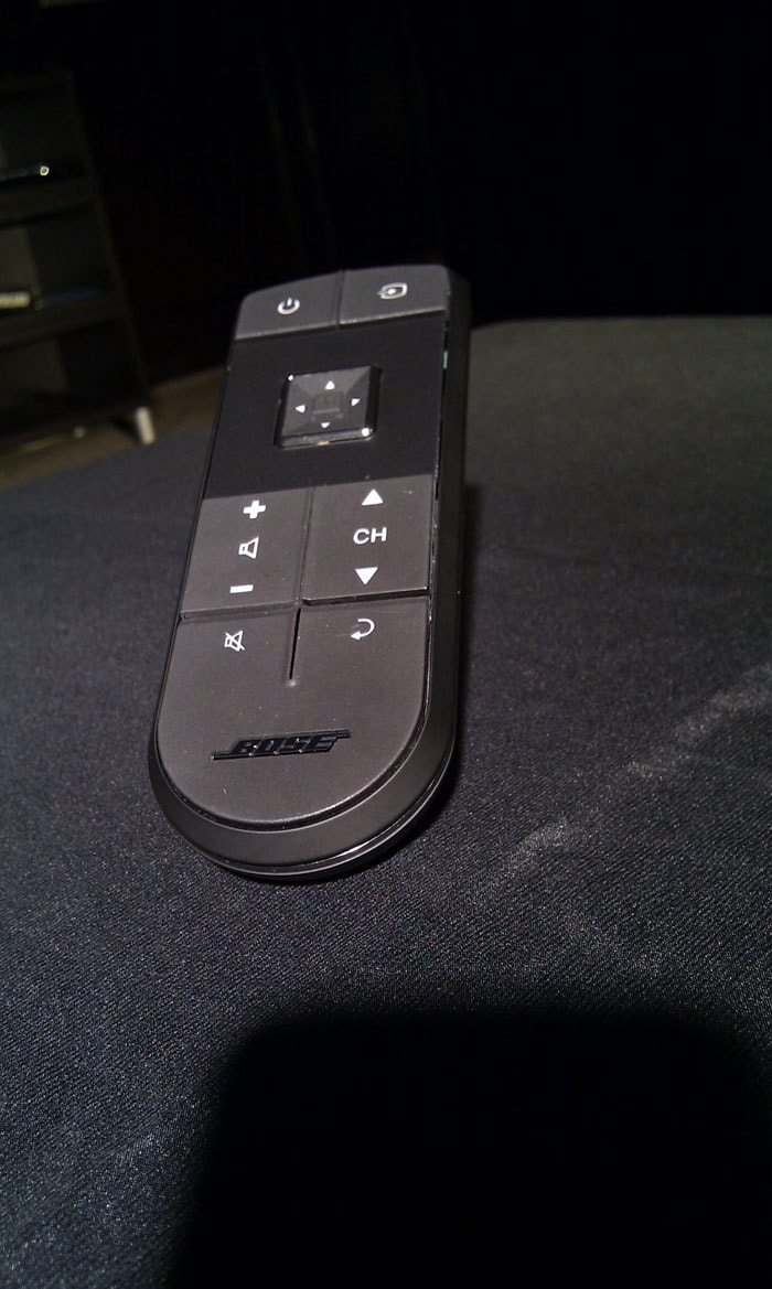 Bose's simplified remote. All functions are integrated on the clickable track pad of the remote. (Photo: Sameer Mitha)