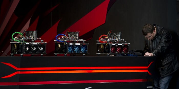 A man works on a booth promoting computer hardware cooling products at the CeBIT IT fair. (Photo: AFP)