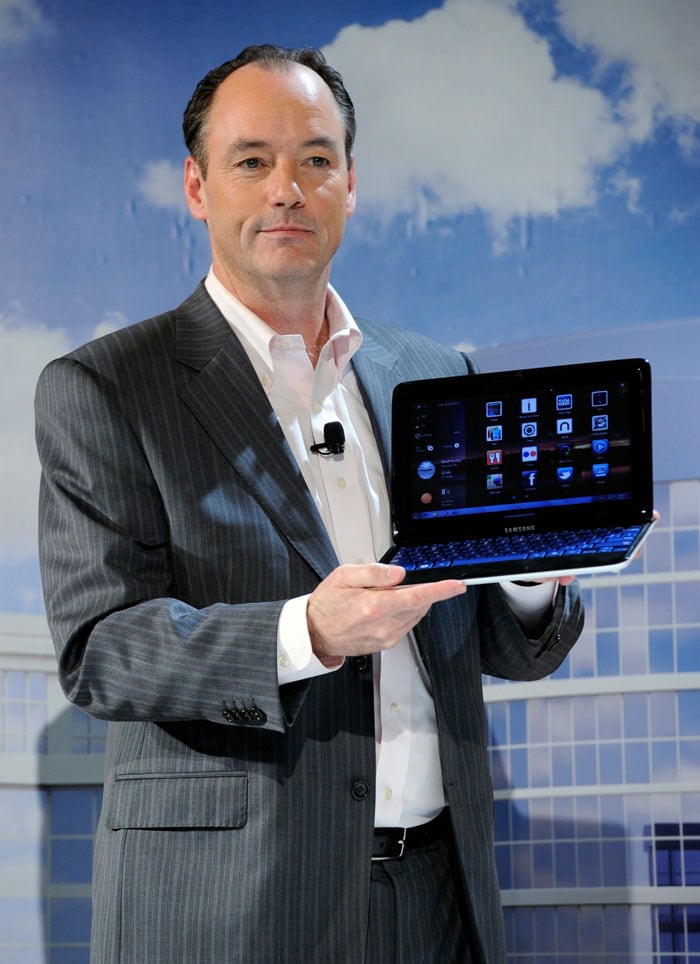 Samsung Electronics America's President of Consumer Business Division Tim Baxter displays the Samsung 7 Series Sliding PC featuring a keyboard that slides out of a tablet design is displayed during a press event at the 2011 International Consumer Electronics Show.