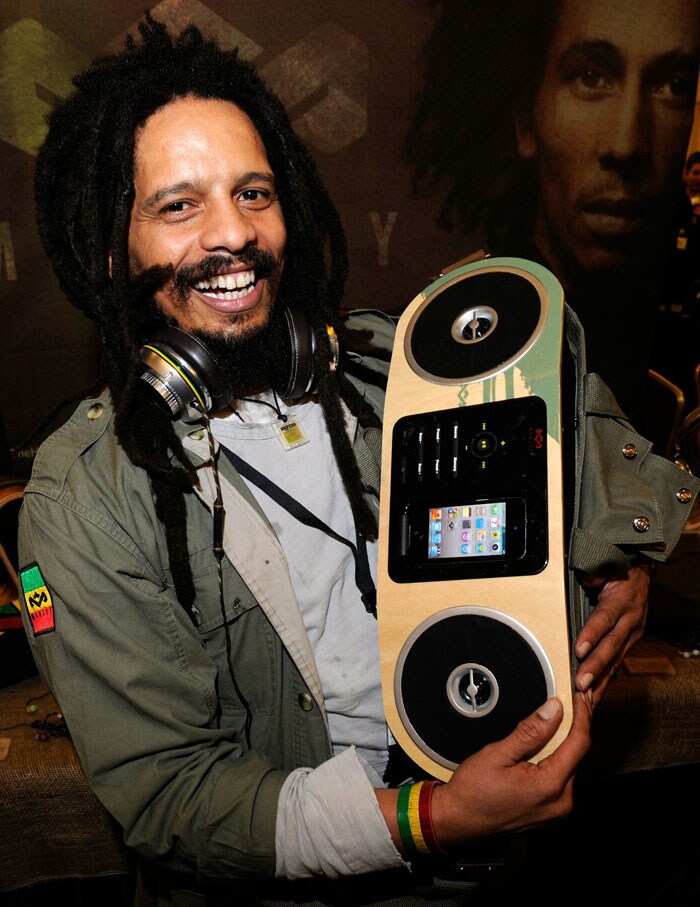 Rohan Marley, son of late Reggae musician Bob Marley, displays a Marley Jammin' Roots Rock Speakerbag featuring an FM radio and a docking station for iPhones and iPods from House of Marley while wearing the company's Marley Destiny Trenchtown Rock headphones during a press event at the Venetian for the 2011 International Consumer Electronics Show.