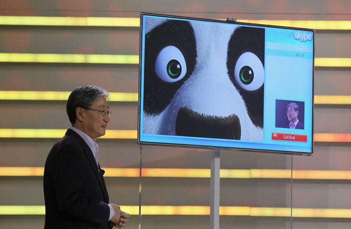 Samsung President and General Manager of Visual Display Business Boo-Keun Yoon taking a Skype call with Kung-Fu Panda as he delivers a keynote address at CES 2011.