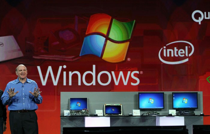 Microsoft CEO Steve Ballmer stands next to a display of prototype computers at the 2011 International Consumer Electronics Show.