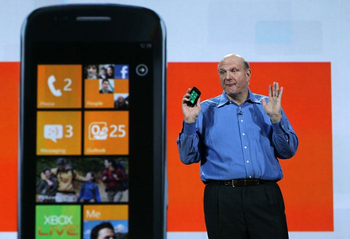 Microsoft CEO Steve Ballmer holds a Windows Phone 7 and talks about its future at CES 2011