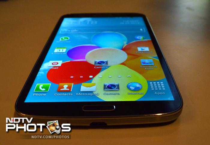 The phone has a physical Home button and a micro-USB port at the bottom.