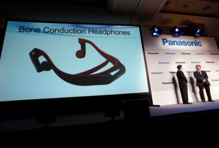 The headphones connect to a TV via the Bluetooth wireless standard and attach to your head like a normal set of headphones.