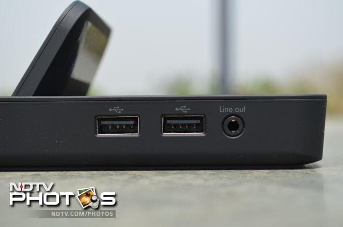 The desktop dock that features 2 USB ports and a line out port on the right hand side.