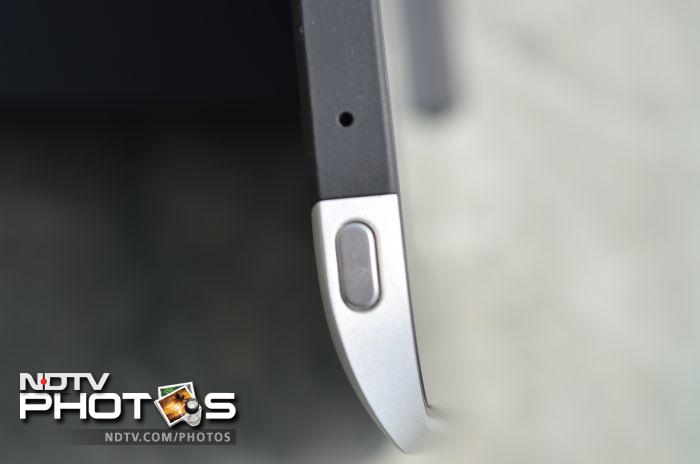 A power/screen-lock button on the top left edge of the tablet.