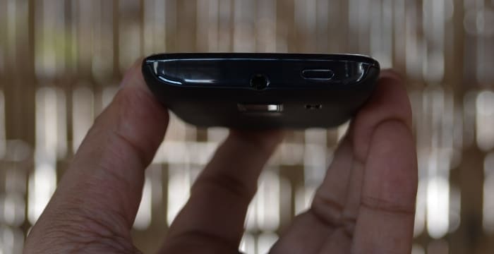The top panel has the power on/off button and 3.5 mm jack.