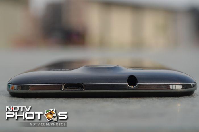 The micro-USB port and the 3.5 mm headset jack sit at the top of the phone.