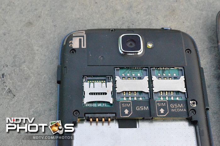 The two SIM card slots and the microSD card slot are located above the battery compartment.