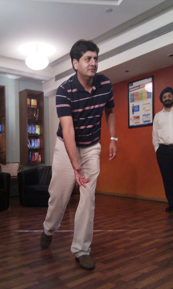 Gadget Guru Vikram Chandra trying out the bowling game for Microsoft's Kinect. (Photo: Sameer Mitha)