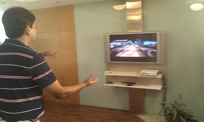 Vikram Chandra trying his hand at bowling. (Photo: Sameer Mitha)