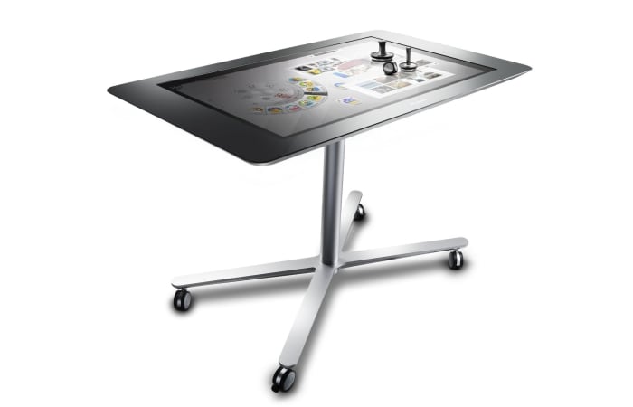 The "multi-user, multi-touch, multi-mode" table computer with a starting price of $1,699 can be used by several people simultaneously for communal activities such as games or for individual endeavors such as updating Facebook.