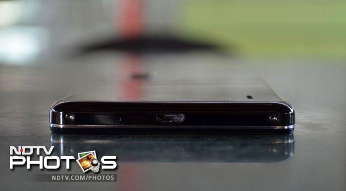 The bottom edge has a microphone along with the micro-USB port.