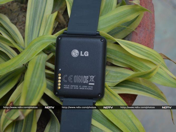 The G Watch (above) comes with a 400mAh battery that lasts slightly longer than the Samsung on a typical work day. The back features metallic contacts where the charging cradle connects.