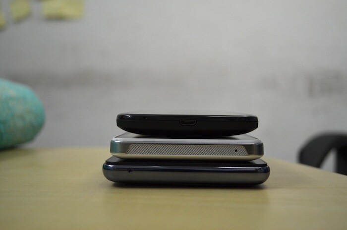 The Micromax Superfone Canvas A100 (top) has the Micro-USB port for charging/ data transfer at the bottom of the phone.