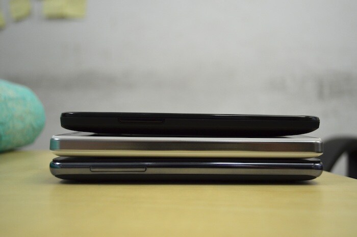 The left side of the Spice Stellar Horizon Mi-500 (centre) is completely bare while the Micromax Superfone Canvas A100 (top) and iBall Andi 5c (right) have volume rockers.
