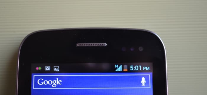 The chrome speaker grill, front camera and sensors are positioned just above the screen.