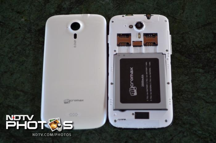 The phone has a removable back cover that hides the battery compartment and the SIM card slots.