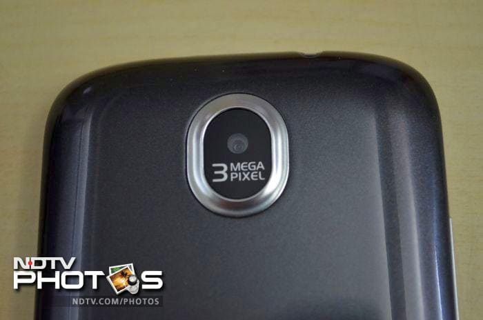 The glossy back features a 3-megapixel-camera lens surrounded by a chrome ring.