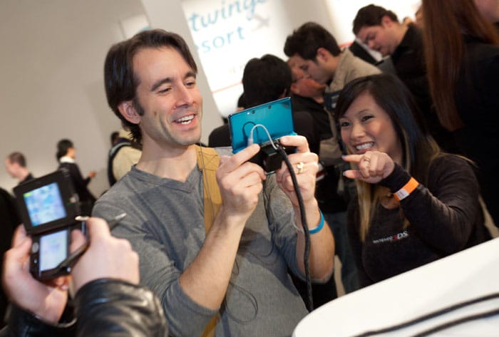 Journalist getting a hands on with the device at the launch event of the Nintendo 3DS.