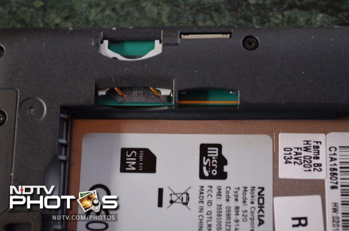 The SIM card slot and the microSD card slot are located adjacent to the battery compartment.