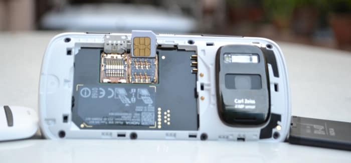 The battery can be removed to reveal the microSD and Micro-SIM (right).