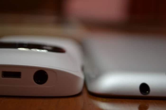 Nokia 808 PureView sitting next to an iPad 2.
