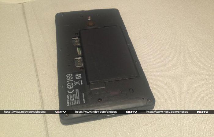 Opening the rear cover reveals three slots: One for the micro-SD card and two for micro-SIM cards.