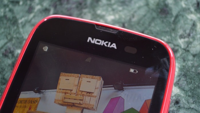 There is no front camera on the device. Here we see the ambient light sensor on the smartphone.