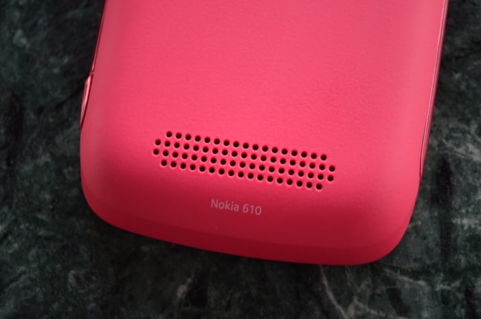 The loudspeaker grill is located on the back panel at the bottom of the device.