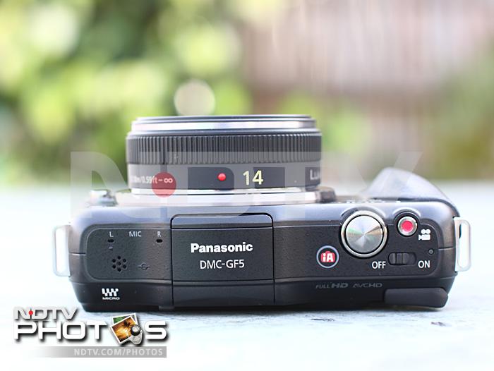 The top of the camera is rather neat, especially given the number of buttons, a pop-up flash, stereo mic and the speaker grill one can find here.