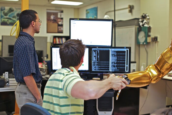 Engineers at NASA's Johnson Space Center test software upgrades on Robonaut 2. (Photo: NASA)