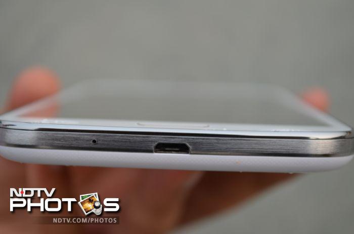 The Micro-USB port at the bottom of the phone.