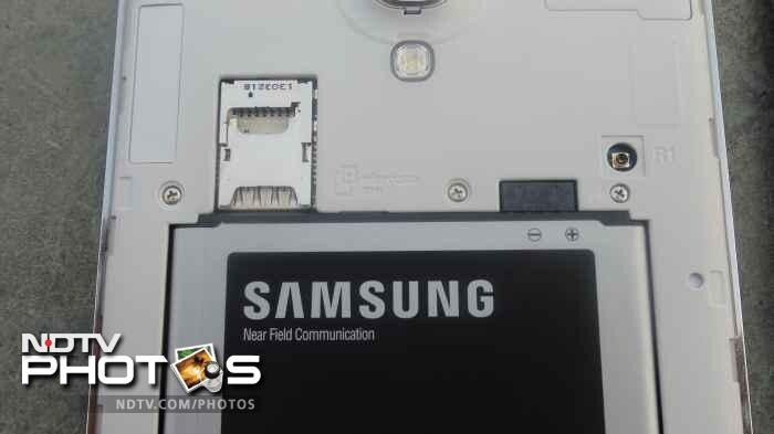 The phone's micro-SIM and microSD card slot have been stacked together.