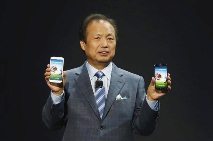 JK Shin, President and Head of IT and Mobile Communication Division, holds up Samsung's latest Galaxy S4 phones during its launch at the Radio City Music Hall in New York.