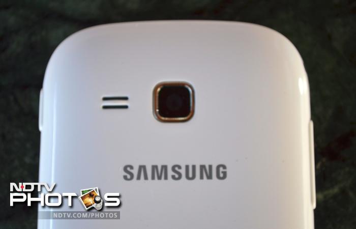 The 3.2 megapixel camera lens and a speaker outlet is located towards the upper part of the back, with the Samsung branding just underneath them.