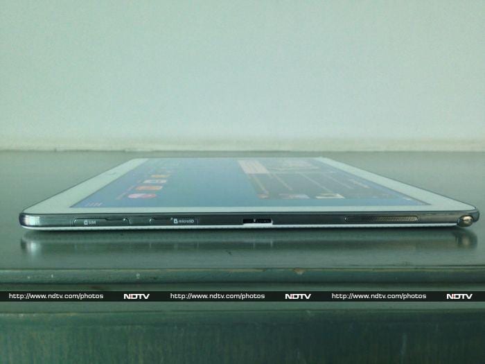 On the right edge, you can see the covered SIM card and microSD slots, the USB 3.0 charging/data port, a speaker grille, and the S Pen in its silo.