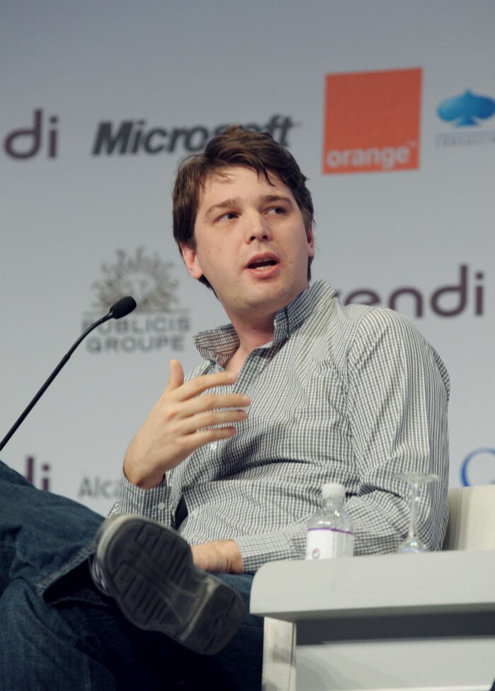 Andrew Mason, founder and CEO of Groupon, speaks at a plenary session. (Photo: AFP)