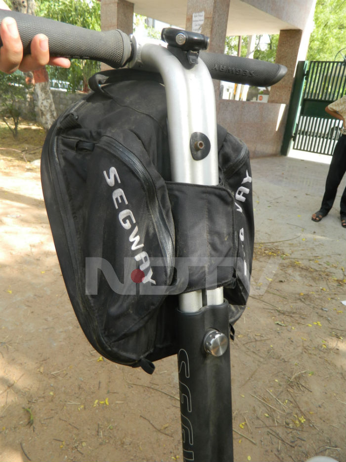 If you like, you can attach a pouch or a carrying case to the Segway. Although it won't carry a lot of weight, a few books and a netbook would do just fine.