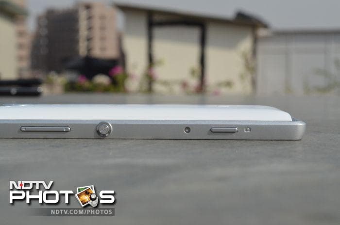 On the right side you'd see a volume rocker, big round aluminium power/screen-lock button towards the middle, and a camera button, also made of metal.