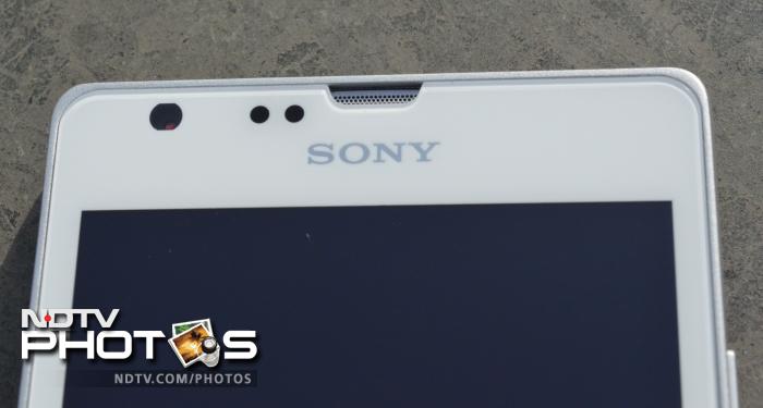 The front camera lens, sensors and the earpiece are placed above the screen along with Sony branding.