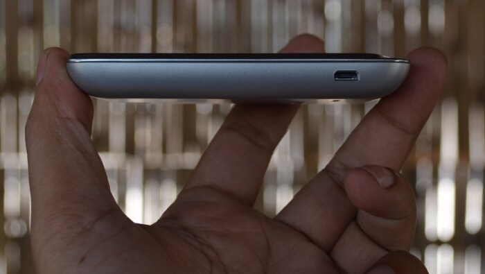 The left panel of Sony Xperia tipo has the USB/charging slot.